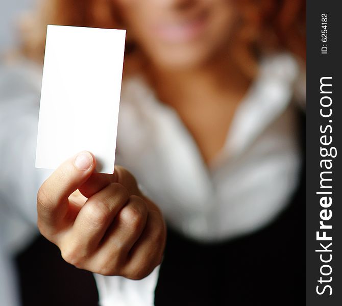 Pretty girl holding white blank media, against white. Pretty girl holding white blank media, against white.