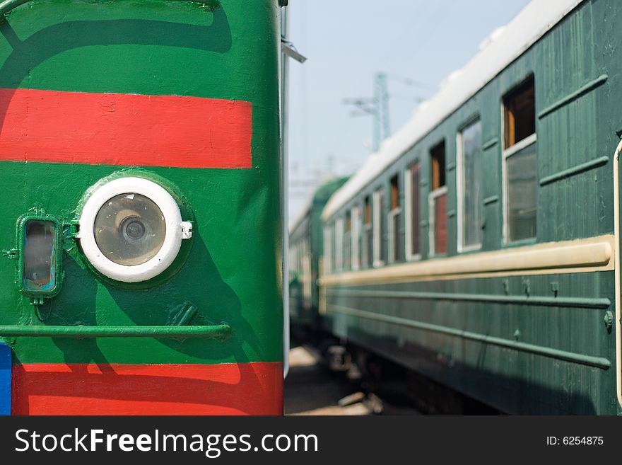 Locomotive and wagon on railroad station