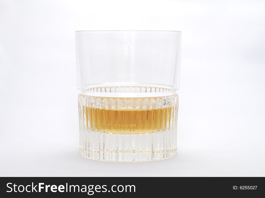 Glass of golden amber aromatic Whiskey. Glass of golden amber aromatic Whiskey