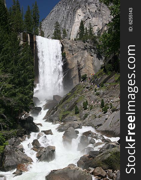 People observing the beauty of Vernal Fall. Merced River. Yosemite national park. California. USA. People observing the beauty of Vernal Fall. Merced River. Yosemite national park. California. USA