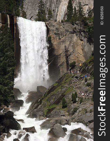 People observing the beauty of Vernal Fall. Merced River. Yosemite national park. California. USA. People observing the beauty of Vernal Fall. Merced River. Yosemite national park. California. USA