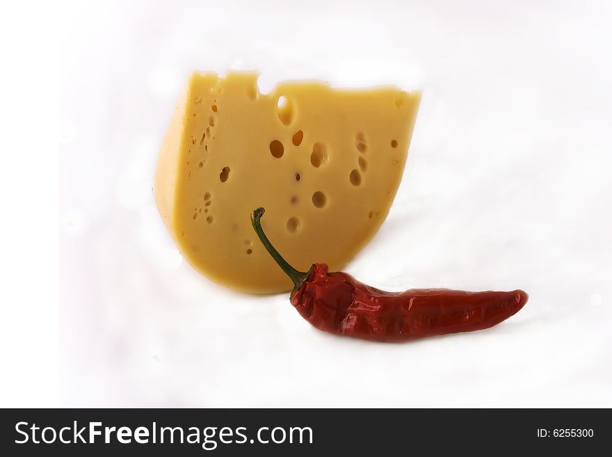 Cheese and pepper upon white background. Cheese and pepper upon white background