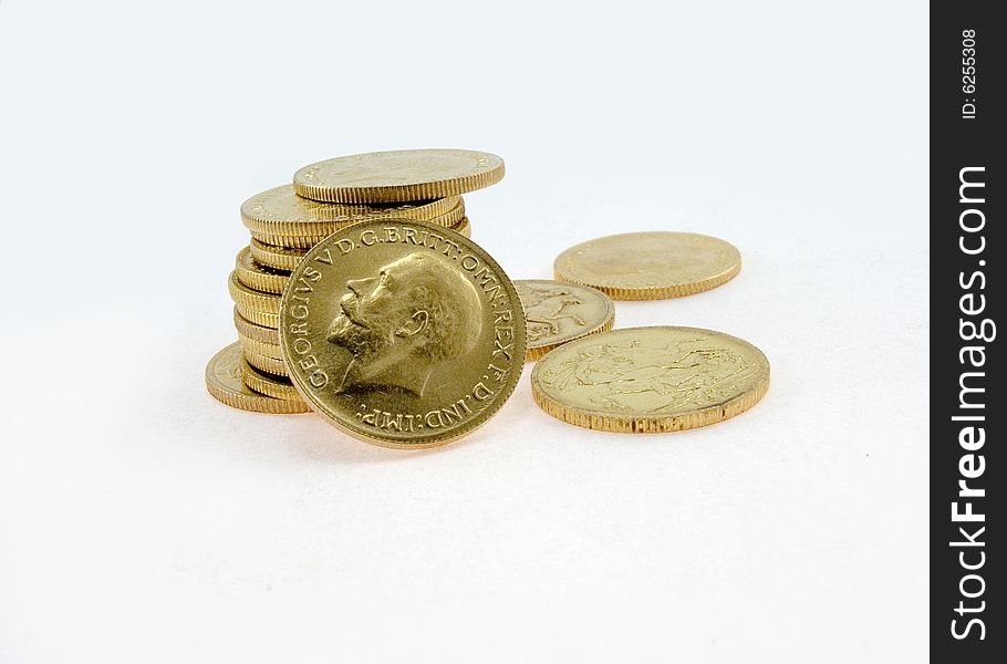 Gold coins on a whitek background