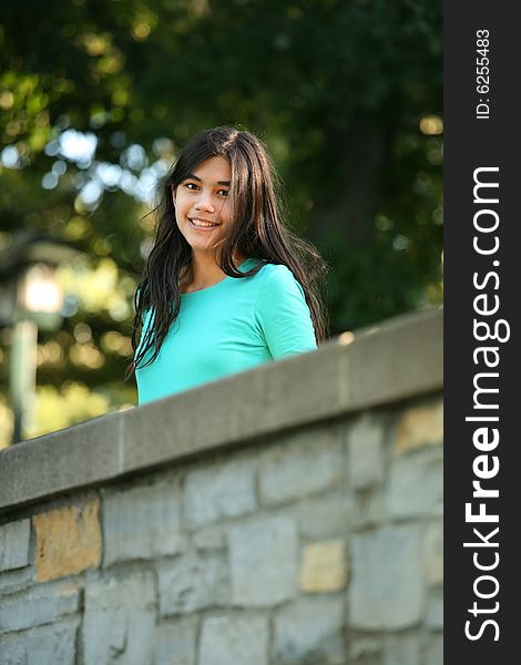 Young Teen Girl Standing On Bridge