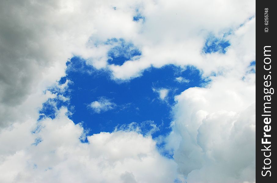 The sky and the clouds looking as a window. Russia, Summer 2008.