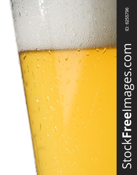 Closeup of condensation on a chilled light beer glass isolated on a white background