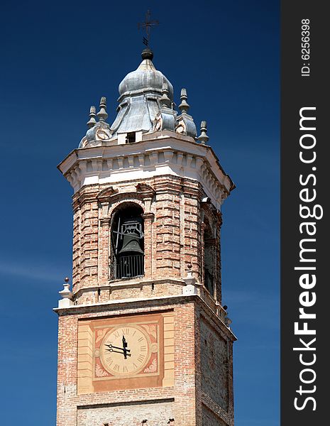 Church clock and bell tower against blue sky. Church clock and bell tower against blue sky