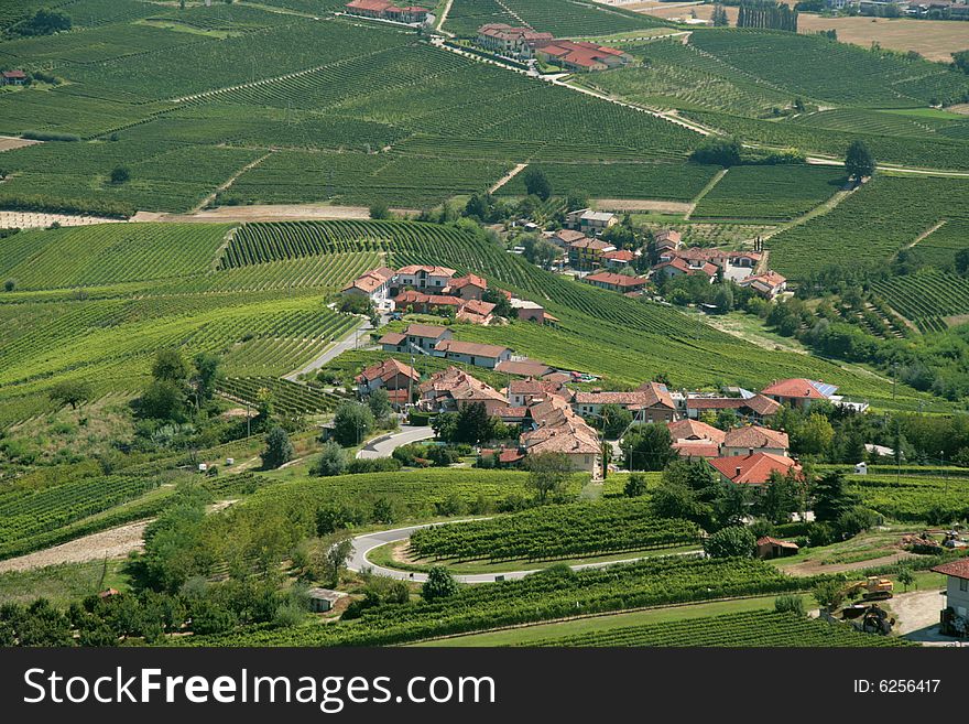 Small Italian town among fields and vineyards
