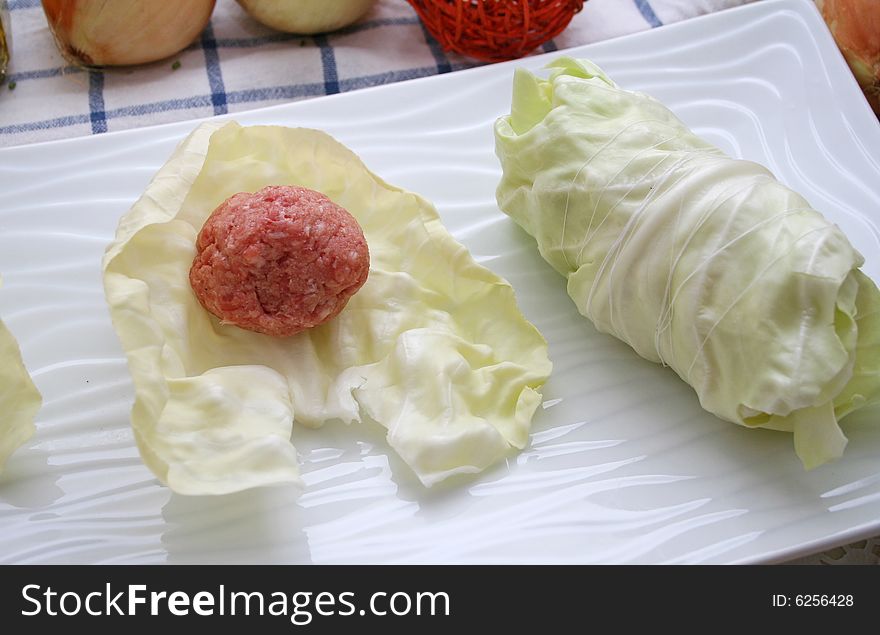 Some cabbage rolls filled with meat in a pan