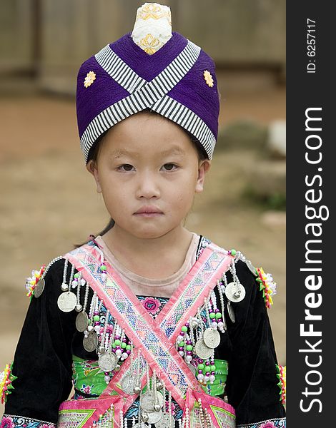 Laos Hmong girl in traditional clothes in the surroundings of Luang Prabang