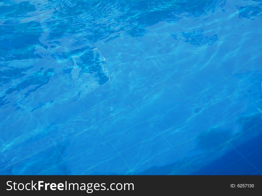 Background texture of clear blue water in pool. Background texture of clear blue water in pool