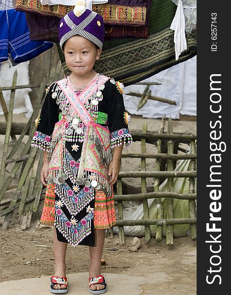 Laos Hmong girl in traditional clothes in the surroundings of Luang Prabang