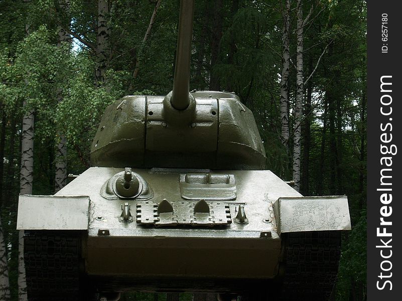 The Russian tank (Second World War) against wood. The Russian tank (Second World War) against wood