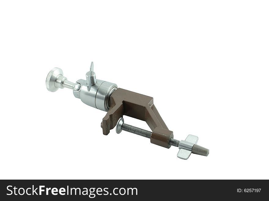 The portable support for the camera, fastens on a motionless subject. It is isolated on a white background. The portable support for the camera, fastens on a motionless subject. It is isolated on a white background