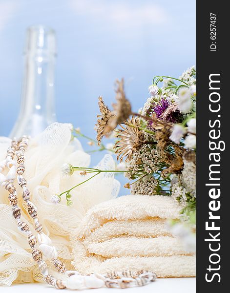 Bath background with towel, sponge and bottles