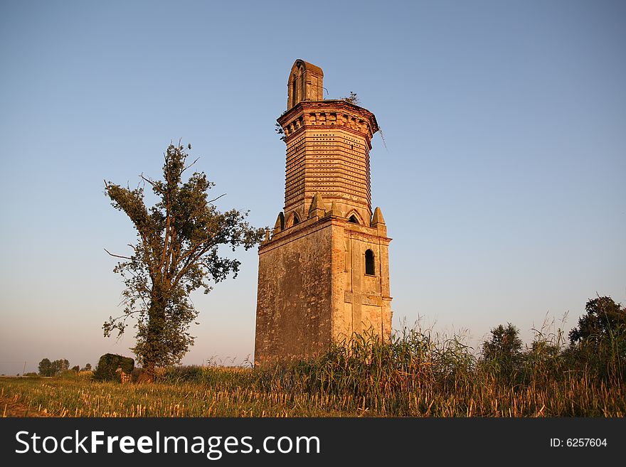 An ancient military tower in a field