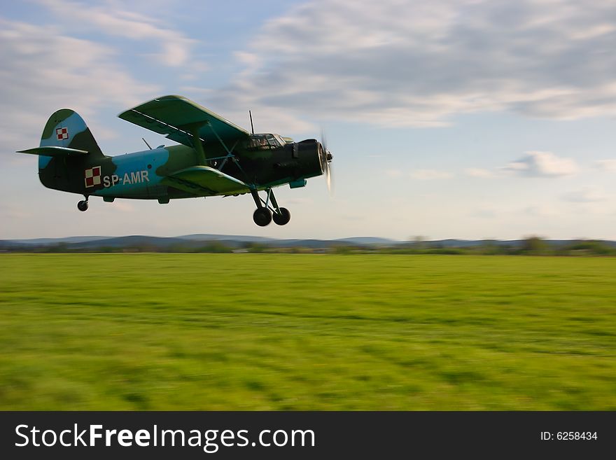 Landing biplane in airport in poland