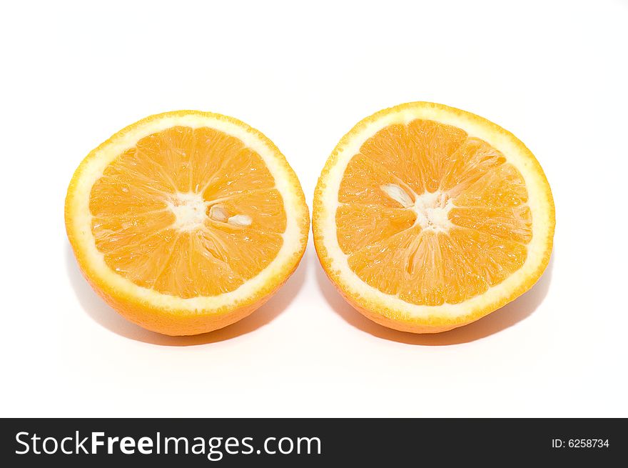 Two piece of orange fruit on background