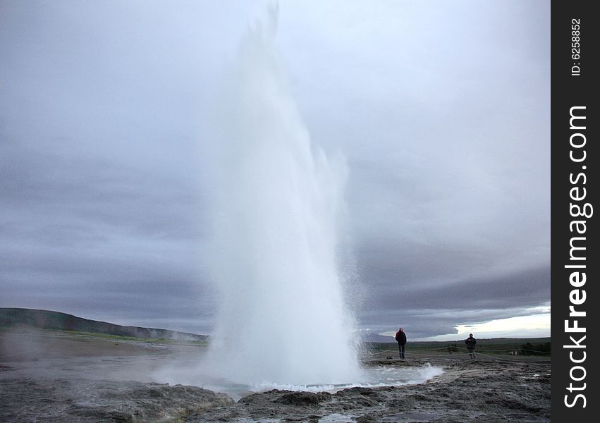 Geyser erupting at dusk in Iceland. Geyser erupting at dusk in Iceland