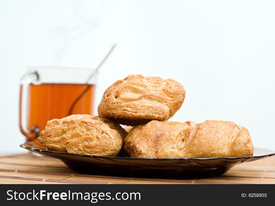 Baked tasty cakes and cup of tea. Baked tasty cakes and cup of tea