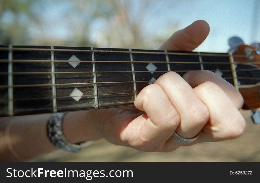 Hand Playing Guitar