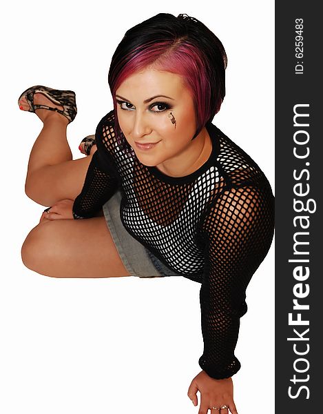 A young pretty woman sitting on the floor in a studio and having fun taking
pictures from the front for white background. A young pretty woman sitting on the floor in a studio and having fun taking
pictures from the front for white background.