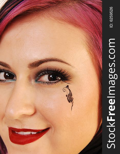 An close up head shot of a lovely, beautiful young woman with a
black butterfly on her cheek. An close up head shot of a lovely, beautiful young woman with a
black butterfly on her cheek.