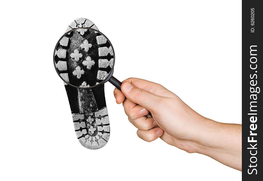 Magnifying glass in hand and shoe printout isolated on white background