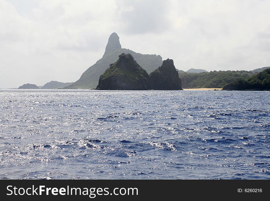 Silhouette of the Two Brother on the foerground and Pico Mount in the background at Fernando de Noronha. Silhouette of the Two Brother on the foerground and Pico Mount in the background at Fernando de Noronha