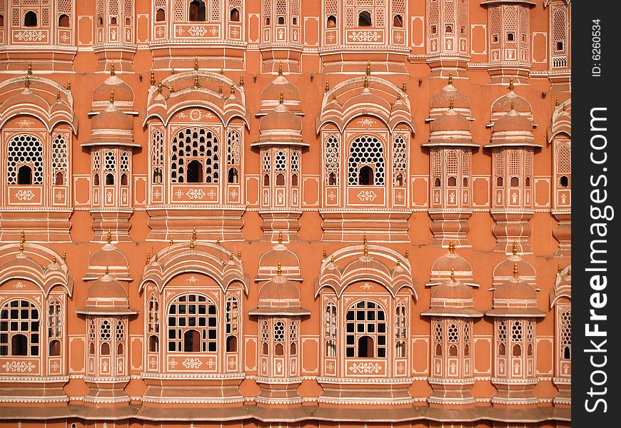 Palace in Jaipur, India. It was built in 1799 by Maharaja Sawai Pratap Singh, and designed by Lal Chand Usta in the form of the crown of Krishna, the Hindu god. It forms part of the City Palace and extends the Zenana or women's chambers, the chambers of the harem. Its original intention was to allow royal ladies to observe everyday life in the street below without being seen. Palace in Jaipur, India. It was built in 1799 by Maharaja Sawai Pratap Singh, and designed by Lal Chand Usta in the form of the crown of Krishna, the Hindu god. It forms part of the City Palace and extends the Zenana or women's chambers, the chambers of the harem. Its original intention was to allow royal ladies to observe everyday life in the street below without being seen.