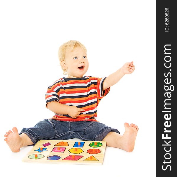 Beautiful young child playing intellectual game. Isolated on white background