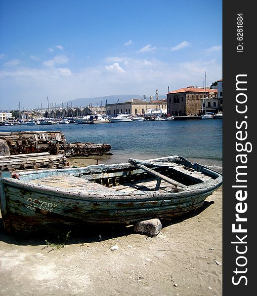 This is an old wooden boat at the old harbor in Chania, Crete. This is an old wooden boat at the old harbor in Chania, Crete.