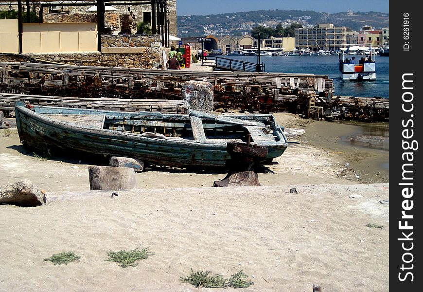 This is an old wooden boat at the old harbor in Chania, Crete. This is an old wooden boat at the old harbor in Chania, Crete.