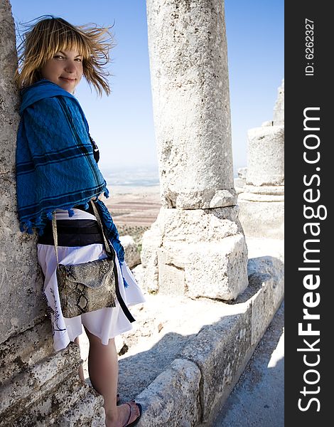 Windy day and smile girl in old ruins. Windy day and smile girl in old ruins