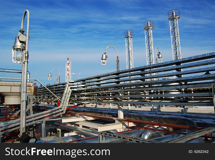 Industrial zone, Steel pipe-lines on blue sky