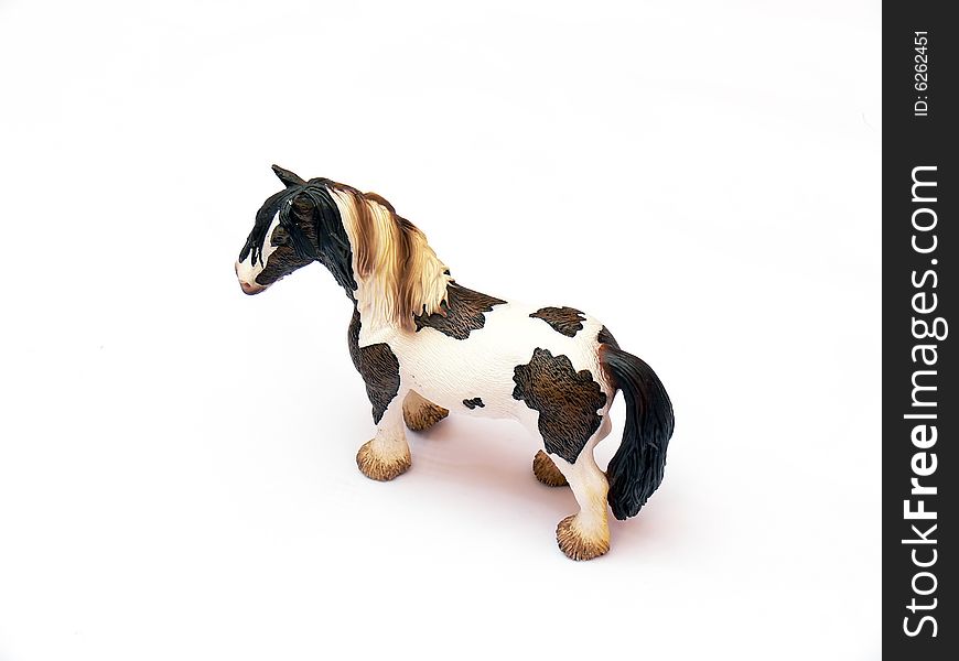 Close up of the plastic toy horse isolated on white background.