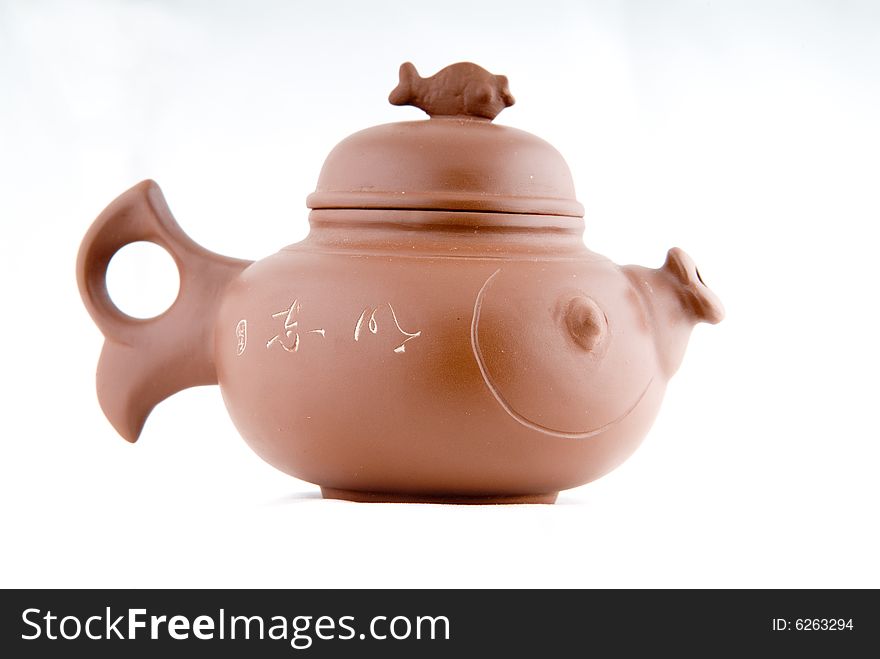 The fictile teapot is in white background. The fictile teapot is in white background.