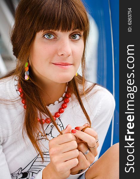 Young surprised girl in red necklace. Young surprised girl in red necklace