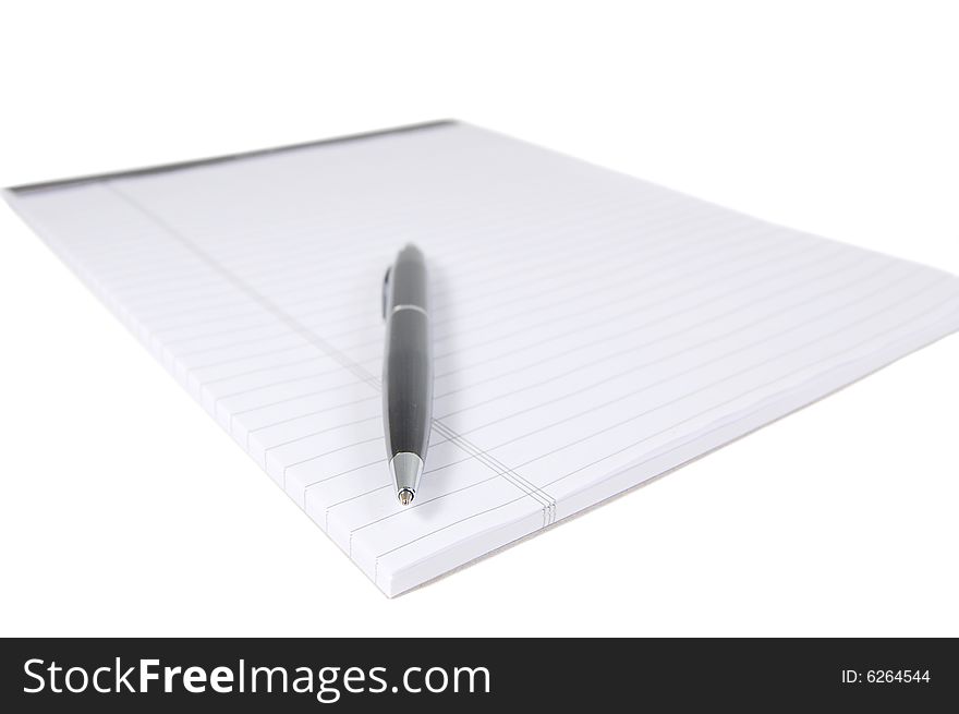 Notepad and a black pen isolated on white. Notepad and a black pen isolated on white