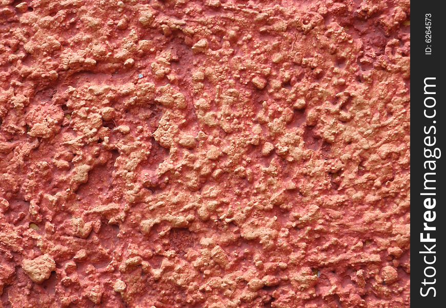 Closeup of a red plastered wall. Closeup of a red plastered wall.