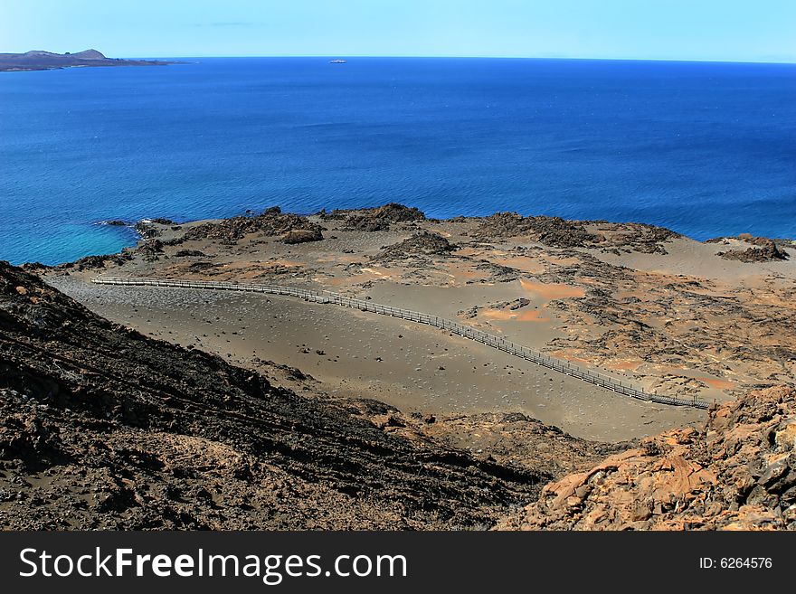 Wooden steps traverse the barren landscape of the Galapagos Islands. Wooden steps traverse the barren landscape of the Galapagos Islands