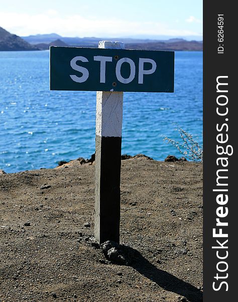 This stop sign warns visitors against walking off the cliff. This stop sign warns visitors against walking off the cliff