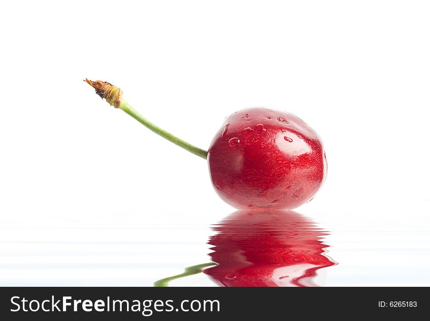 An image of red berry in a water close up