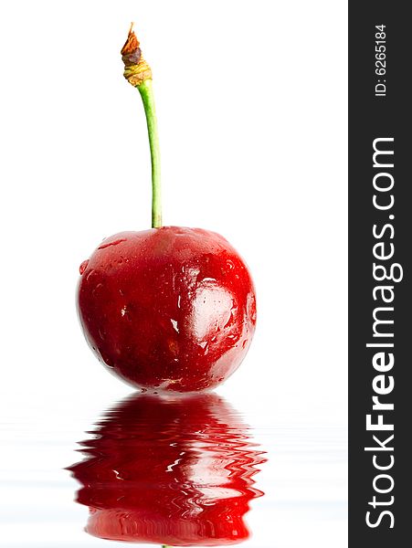 An image of red cherry in a water