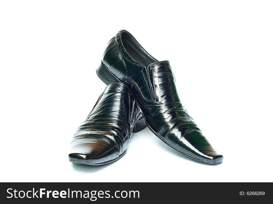 Man's black shoes isolated on clear white background with shadow