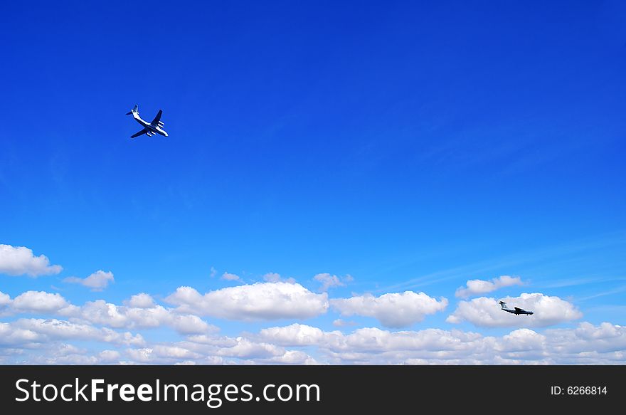 Aircraft against the bright blue background of summer sky. Aircraft against the bright blue background of summer sky.