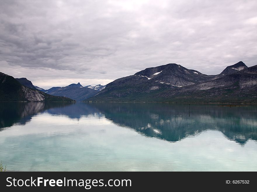 Norway landscape, fjord and mountains in the background