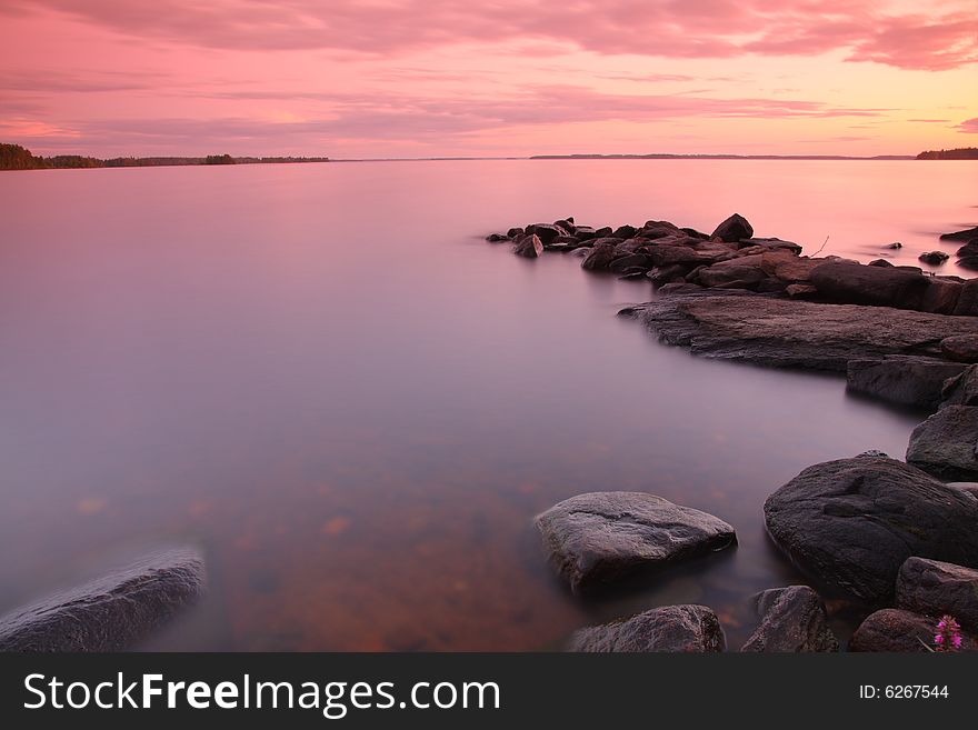 Sunset by the lake, rocks, long exposure