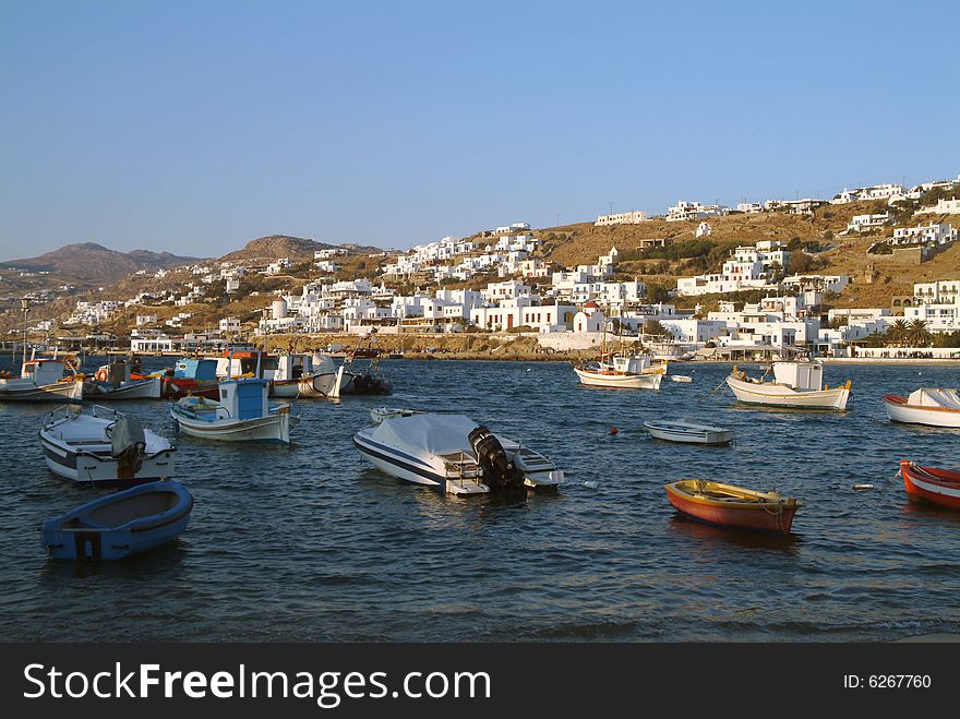 Mikonos skyline and harbor on blue sky day