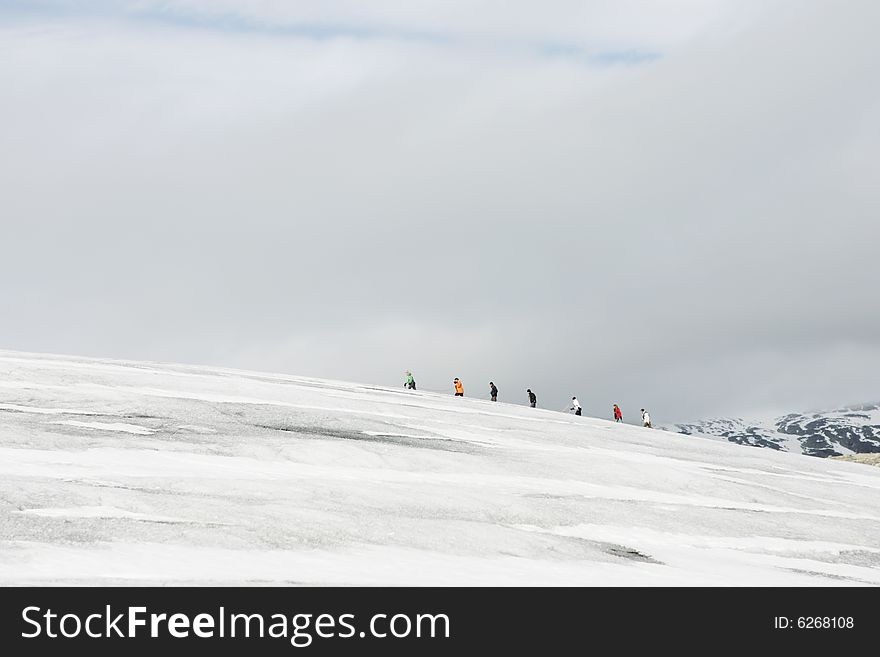 Seven explorers in a glacier